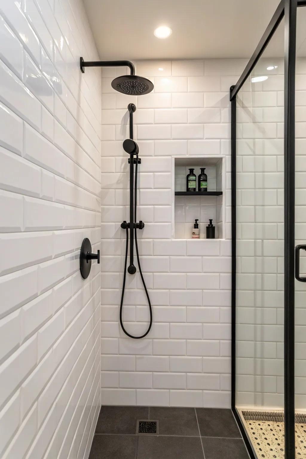 A small shower with black fixtures providing a modern contrast.